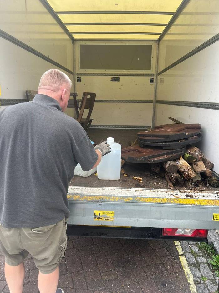 Witchard clearing garden waste and rubble into the van